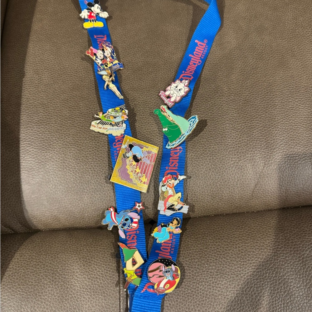 Disneyland lanyard with 12 Disney pins attached
